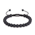 uniqal Schwarzes Onyx Armband mit matten Natursteinen auf weißem Hintergrund – minimalistisches Design und verstellbarer Verschluss für Damen und Herren